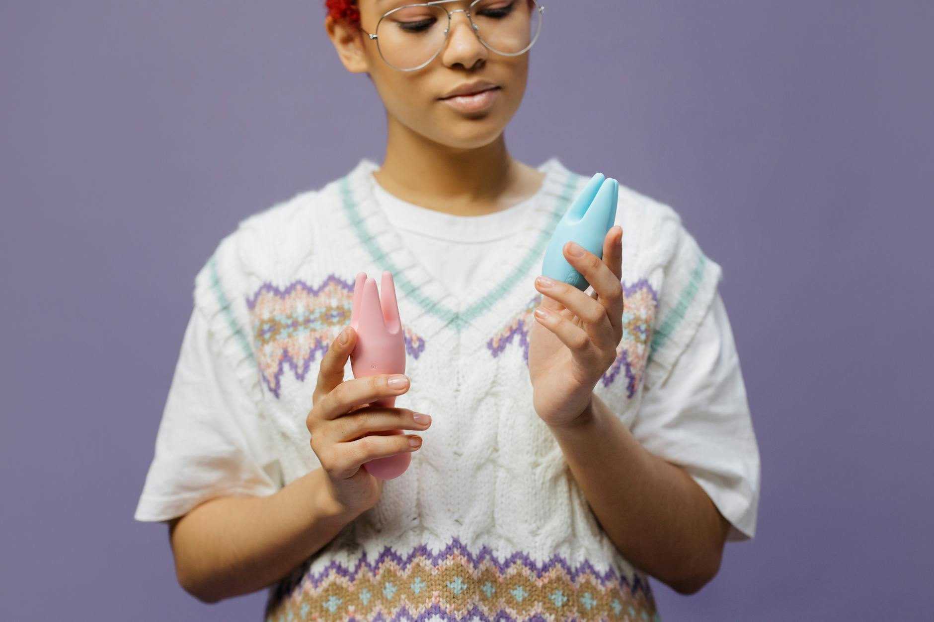 Person holding lemon vibrators and contemplating pleasure options